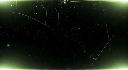 Abstract dark background with light green glowing edges and visible scratches and dust particles, creating a vintage or distressed film effect