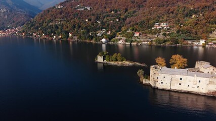 Aerial view of the ancient Castelli di Cannero standing majestically on small islands in Lago Maggiore surrounded by mountains, Cannero Riviera, Piemonte, Italy.