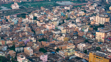 Top down Buildings and Apartment with Multiple Building aerial. Urban Buildings and Apartment at bridge road at Delhi. Cinematic cityscape drone shot. Noida Buildings.
