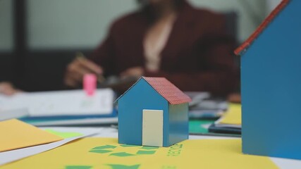 Sustainable business partners discuss renewable energy models and ESG investment strategies for a greener future - Powered by Adobe