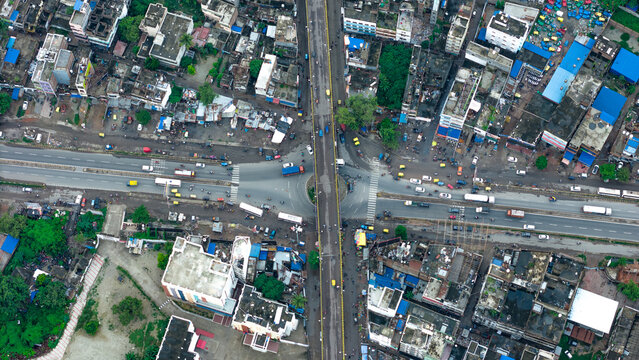 Top down Buildings and Apartment with Multiple Building aerial. Urban Buildings and Apartment at bridge road at Delhi. Cinematic cityscape drone shot. Noida Buildings.
