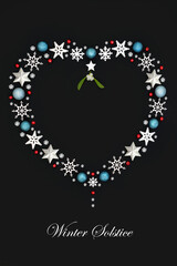 Winter solstice Xmas heart shape romantic wreath decoration, mistletoe, snowflakes, stars, blue spheres, red holly berries. Symbol of love theme. Phrase.