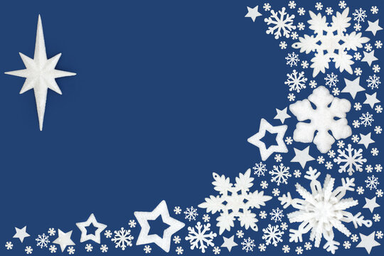 Christmas white snowflake, star bauble decorations, festive border on blue background. Abstract design for Xmas holiday season.