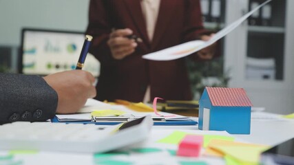 Sustainable business partners discuss renewable energy models and ESG investment strategies for a greener future - Powered by Adobe