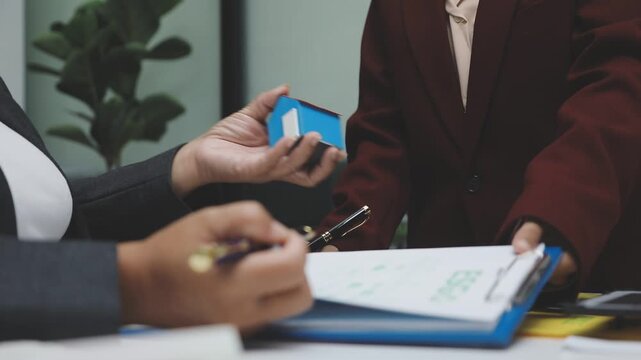 Sustainable business partners discuss renewable energy models and ESG investment strategies for a greener future - Powered by Adobe