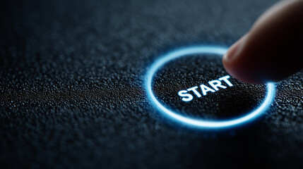 Finger pressing glowing start button in dark futuristic interface