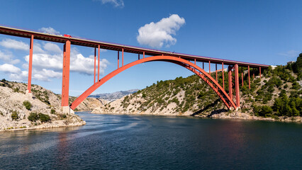 Aerial View of a Coastal Bridge in Croatia – Dramatic Adriatic Waters, Rugged Shores and Scenic Mediterranean Landscape