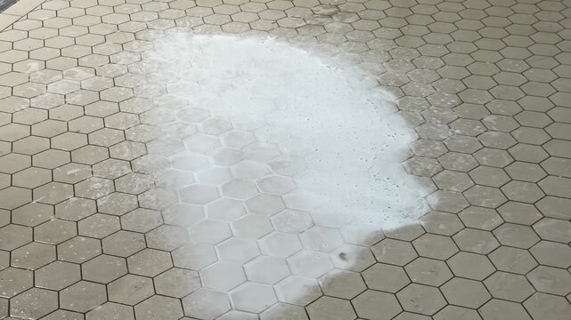 Cleaning powder on tile floor showing hexagonal pattern close-up