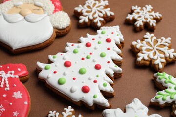 Tasty gingerbread cookies on brown background, closeup. Christmas treat