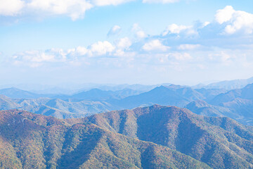 Fototapeta premium Panoramic Mountain View Under Bright Blue Sky at Daedunsan