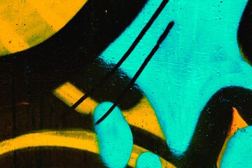 Vibrant graffiti style abstract art in neon blue, yellow. 90s urban aesthetic, bold lines, expressive shapes. Street art, digital backgrounds, urban design, creative projects, modern visuals.