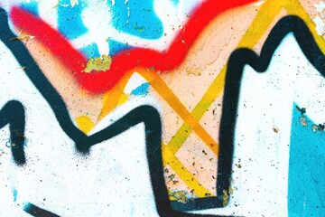 Vibrant abstract graffiti with bold black lines, bright red, blue, yellow. Urban 90s style, colorful, dynamic. Modern street art, creative backgrounds, digital design, urban visuals.