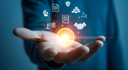 Hand holding glowing digital icons representing business and technology concepts