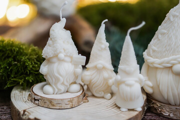 handmade soy wax candles in the cozy room, Christmas lights in the background. 