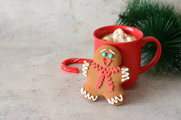 a Christmas Gingerbread Man and a red cup of Hot Chocolate copy space