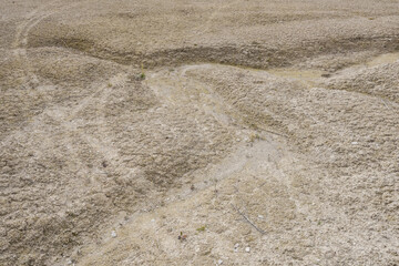 Wide View of Eroded Chalk Quarry Terrain with Sparse Vegetation and Dry Soil Patterns, Belarus