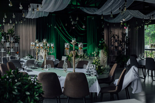 Elegant event venue with luxurious decor and green accents