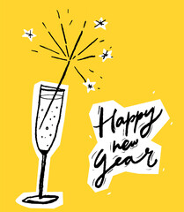 Glass of champagne with a sparkle and hand lettering Happy new year