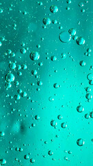 oil drops on water on blue background