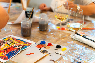 Sip and paint workshop creating art with wine