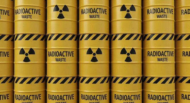 A close up view of neatly stacked yellow barrels featuring the radioactive warning symbol, providing a visual representation of hazardous materials.