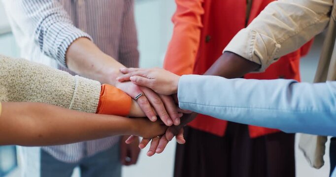 Business people, meeting and huddle with hands together for unity, trust or diversity in office. Closeup, group or team with circle, pile or stack for solidarity, mission or inclusion in workplace