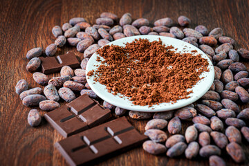 Chocolate bar, Cocoa powder Ingredient for preparating chocolate . Close-up of organic cocoa beans