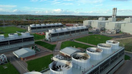 Aerial view of Staythorpe Power Station with its cooling towers and buildings against a backdrop of trees, Newark, England, United Kingdom.