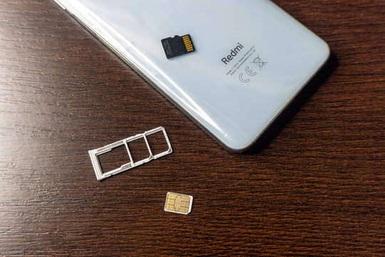 Arad,Arad Romania - November 18 2025: SIM card. SIM card replacement. close-up memory card slot redmi