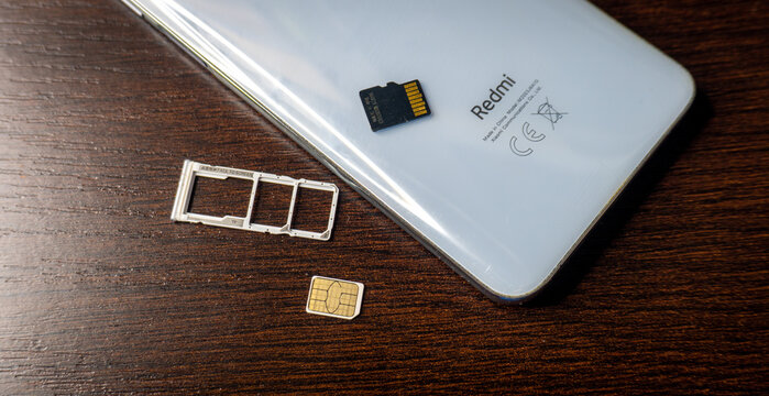 Arad,Arad Romania - November 18 2025: SIM card. SIM card replacement. close-up memory card slot redmi