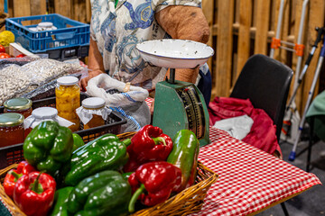 Vendor selling fresh local produce at farmers market
