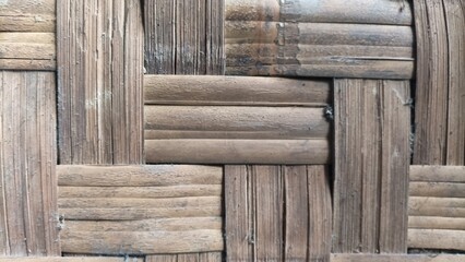 Traditional bamboo weave texture with geometric pattern and natural brown tones,