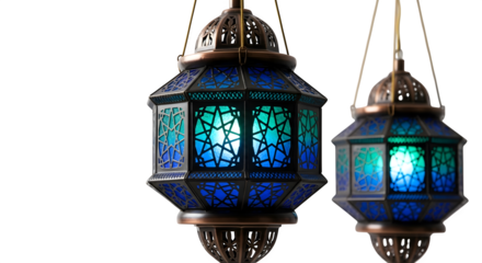 Two ornate antique moroccan style lanterns with colorful stained glass panels illuminated with a soft glow isolated on transparent background