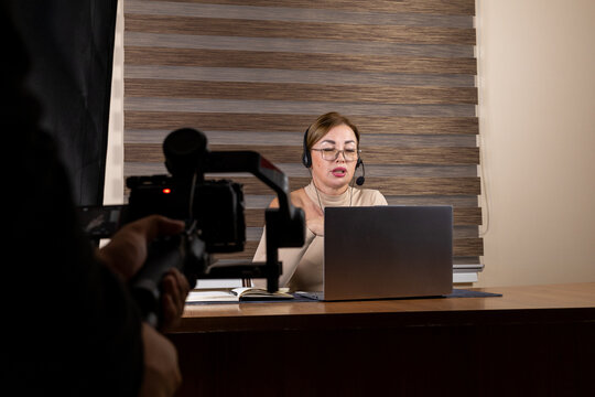 A reporter is conducting an interview via video conference