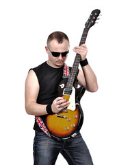 Close up of  rock man expressively plays electric guitar.