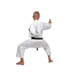 A karate guy in a white kimono and black belt stood in a fighting stance, ready for battle.