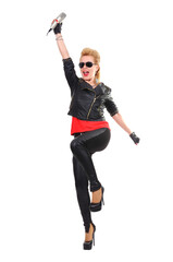 A rocker girl in a leather jacket raised her hand expressively with a microphone