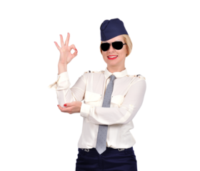 A beautiful flight attendant in uniform shows the OK sign. Transport and service sector concept