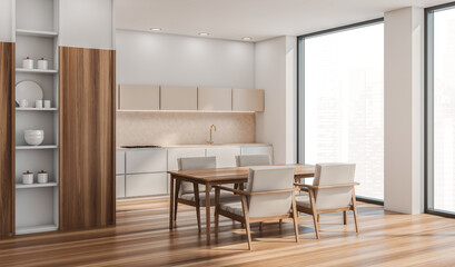 Corner of beige kitchen area with table, armchairs, panoramic windows