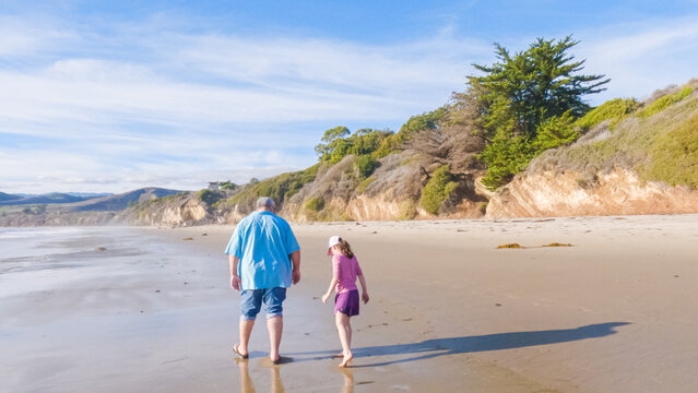 Father, Daughter Stroll El Capitan Beach, California