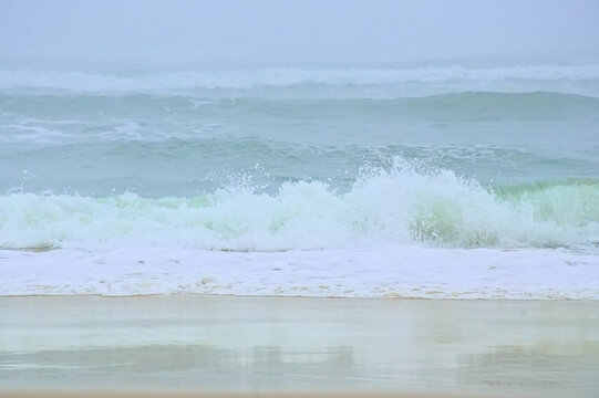 Foggy beach along the Atlantic ocean on a summer morning in Over, Portugal 