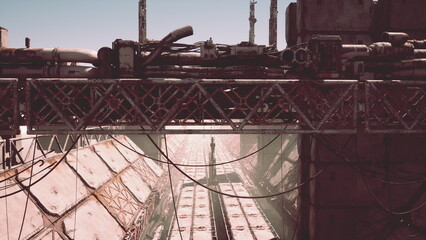 In a desolate space, a lone figure stands between massive industrial structures under a bright sky. Shadows intermingle with pipes and metal, creating an eerie atmosphere of abandonment. © icetray