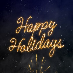 Happy Holidays brilliant script traced with a gold sparkler effect on a dark blue and black smoky background with glowing particle effect and light bursts