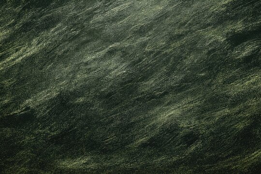Abstract dark green textured background with diagonal light streaks, resembling rough stone
