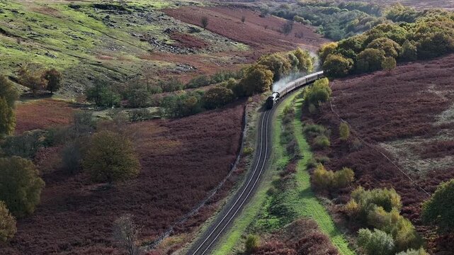 Aerial Video North York Moors Heritage Railway Flying Scotsman Loco 60103.North York Moors National Park in North Yorkshire, England. It was created by meltwater from a glacier 