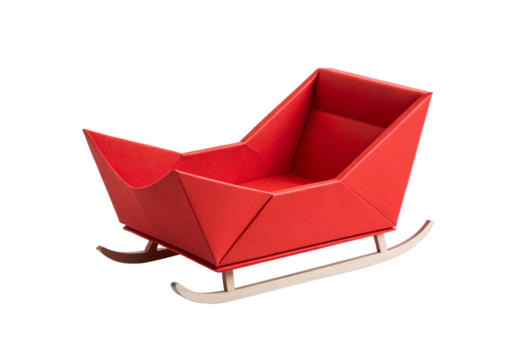 Red angular sleigh with geometric folds and wooden curved runners, isolated on a transparent background