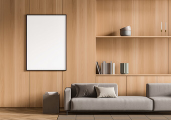 Blank poster mockup in modern interior design with wooden wall background, grey sofa, and bookshelf decor elements. 3D Rendering concept layout