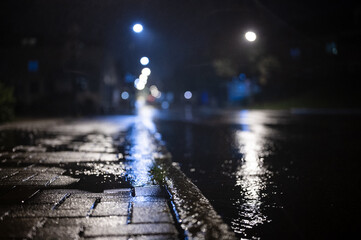 Rainy night street with reflections
