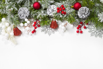 Christmas card with fir branches and Christmas decorations