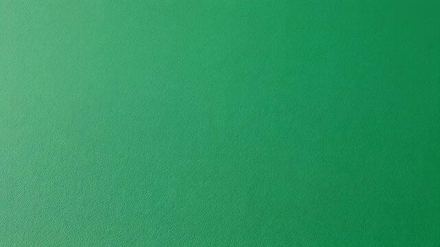 A textured, vibrant green background fills the frame. Light gently falls from one side